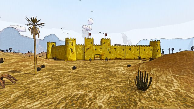 Sandstone town walls and towers seen across the desert